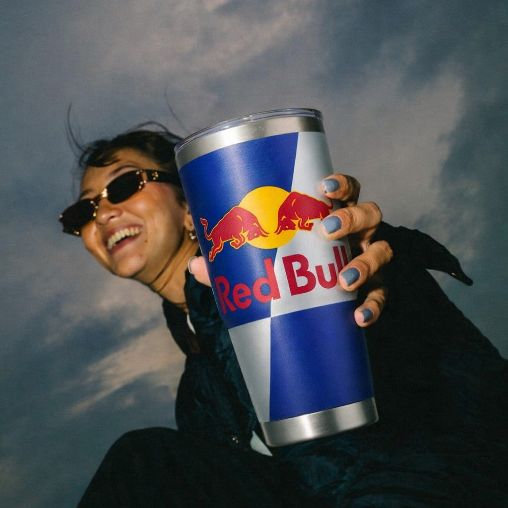 Lady holding a Red Bull branded custom 20oz Travel Tumbler