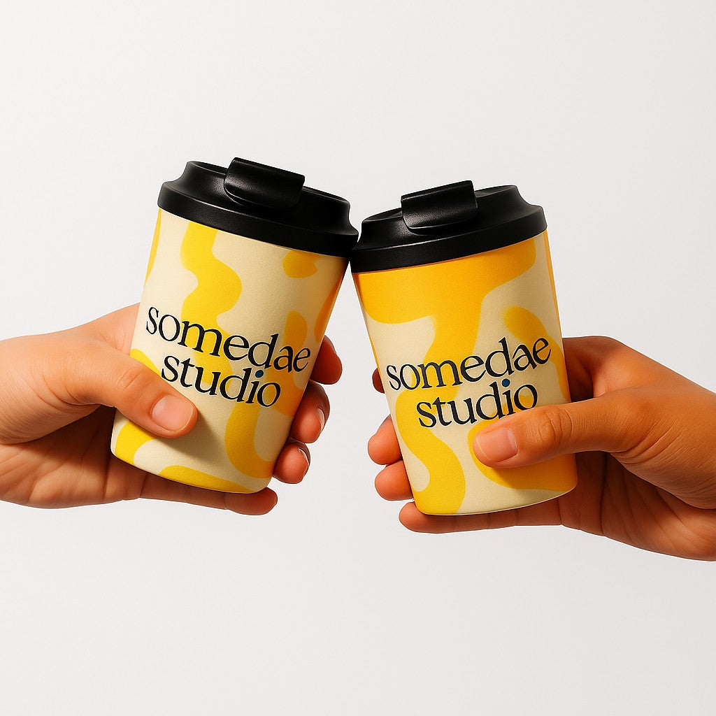 custom branded coffee cups with wrap around yellow printing