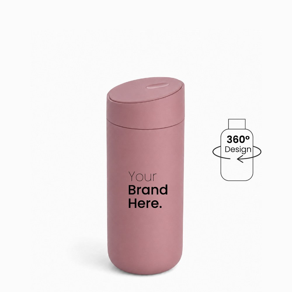 Dusty pink custom logo stainless steel travel tumbler with "your brand here", front view on a white background