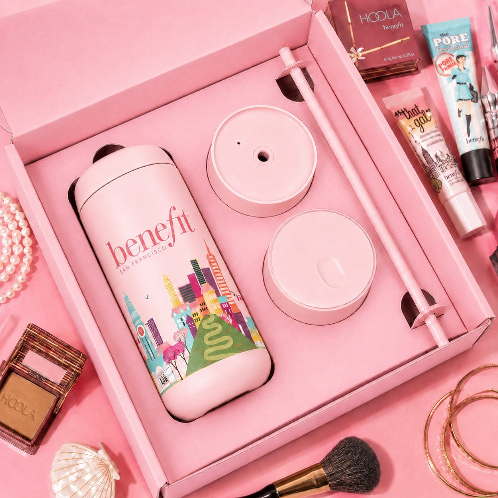 3 in 1 custom tumbler gift set with custom pink packaging on a table with makeup brushes and skin creams