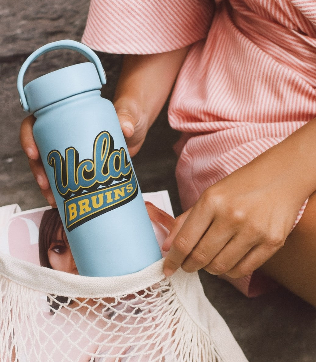 Person holding a business logo 34 oz 1 litre water bottle