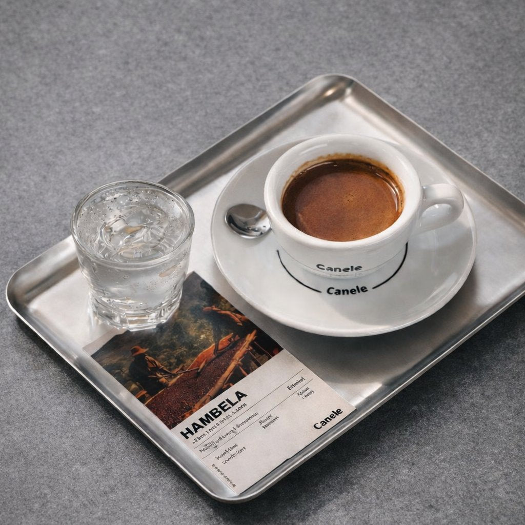 Custom branded espresso coffee cup on a tray with water