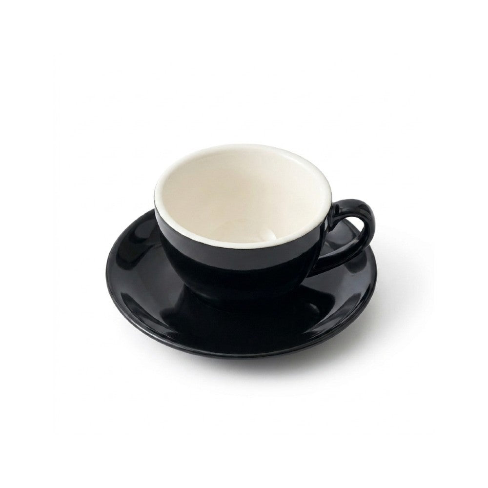 Black espresso cup and saucer on a white background - top down angle