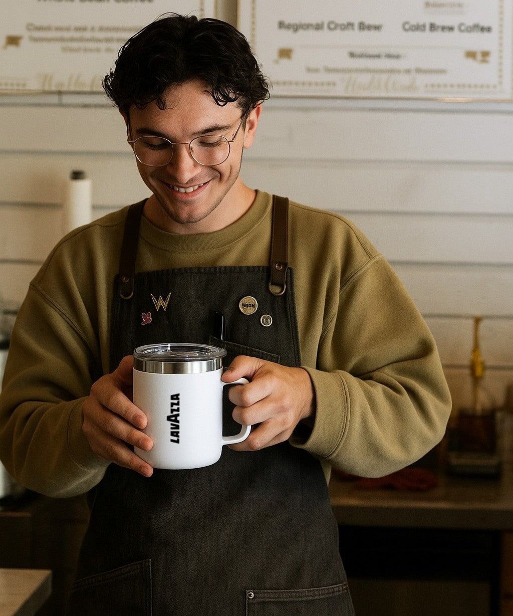 person holding coffee mugs with company logo