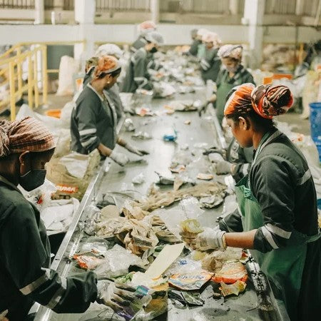 women working in a plastic recycling factory