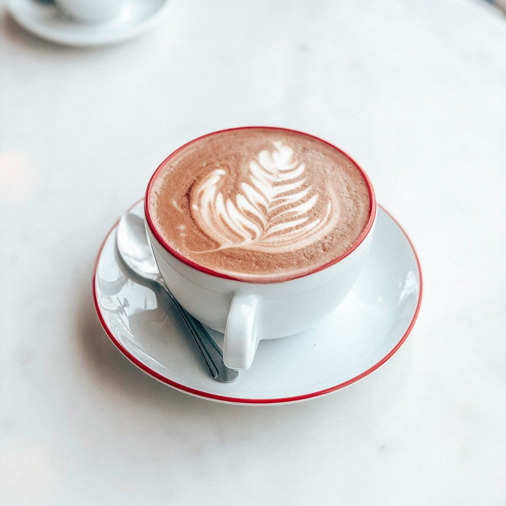 cup of hazelnut mocha on a white table