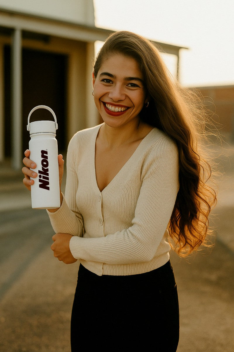 lady holding a white custom water bottle from Just Bottle