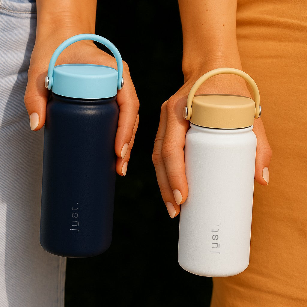 person holding a dark blue water bottle with light blue lid and a white water bottle with a beige lid
