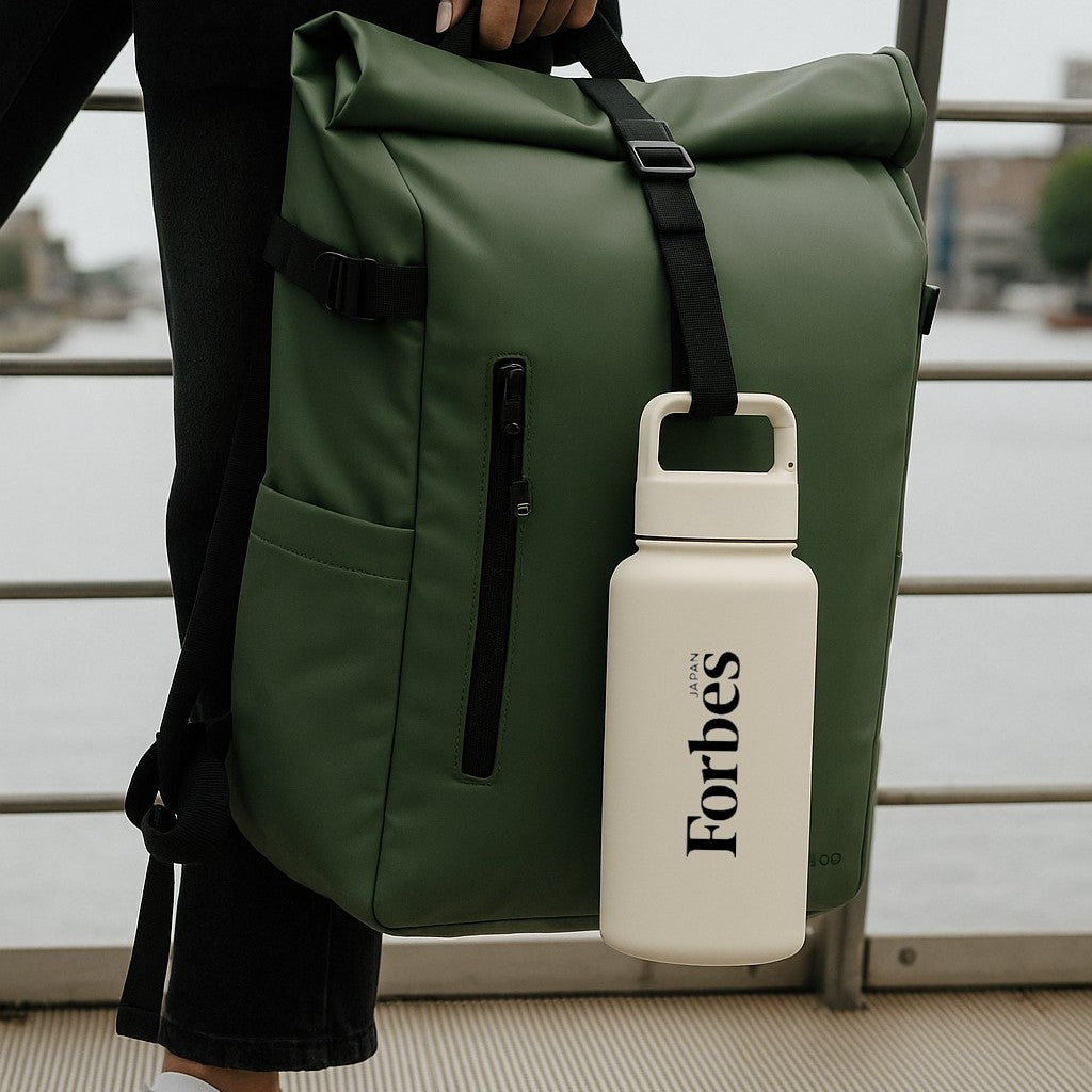 large Forbes custom logo water bottle with carabiner clip handing from bag - Just Bottle