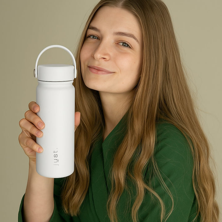 lady holding white water bottle