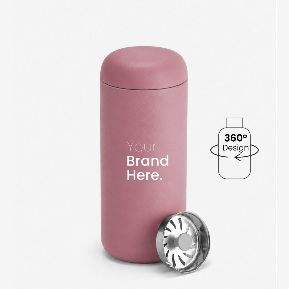 A dusty pink custom logo leakproof tumbler with a matching lid, shown on a white background with a silver metal splash guard filter resting at its base. A graphic overlay on the right indicates '360° Design' is available