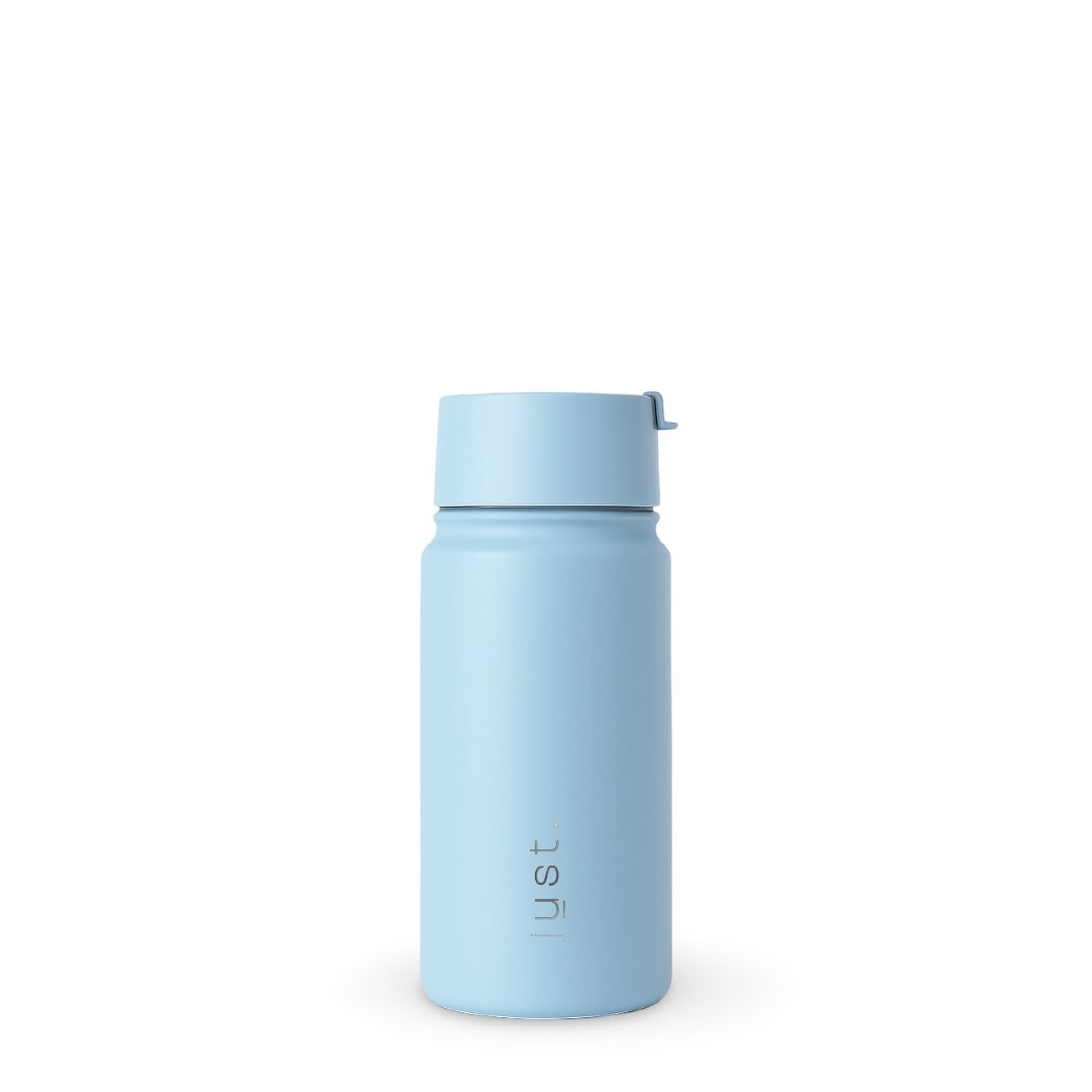Insulated travel coffee mug in light blue, front view