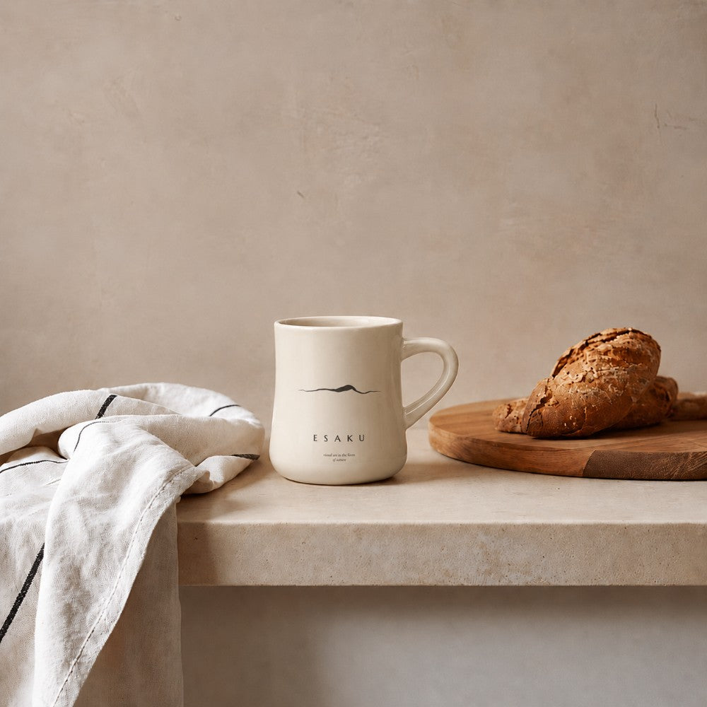 Custom logo classic diner mug on a wooden surface with bread and a towel.