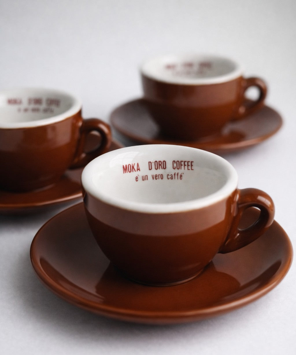 Brown espresso cup with custom branding on the inside of the cup