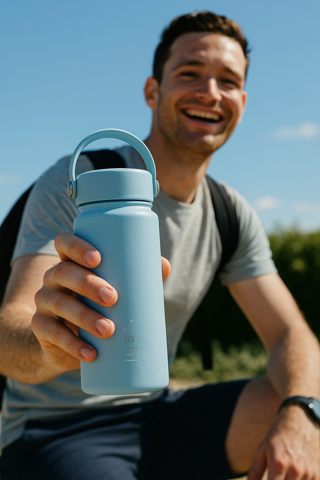 man holding blue reusable bottle