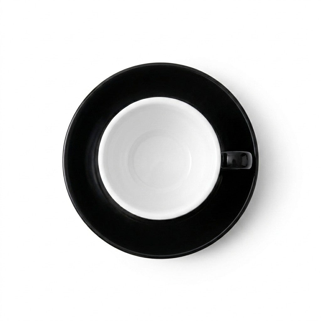 Espresso cup and saucer from top down view on a white background
