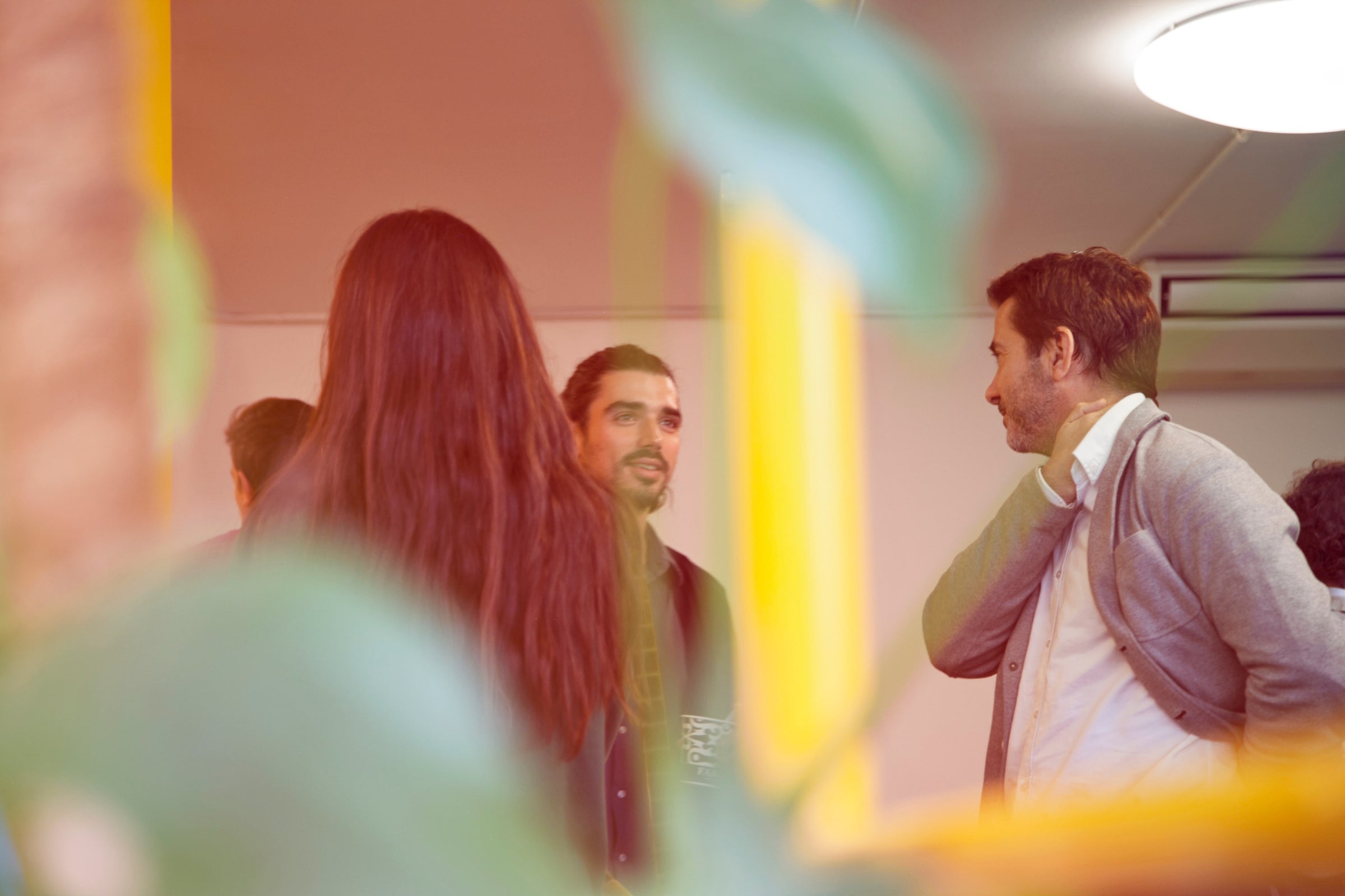 Four people chatting in an office