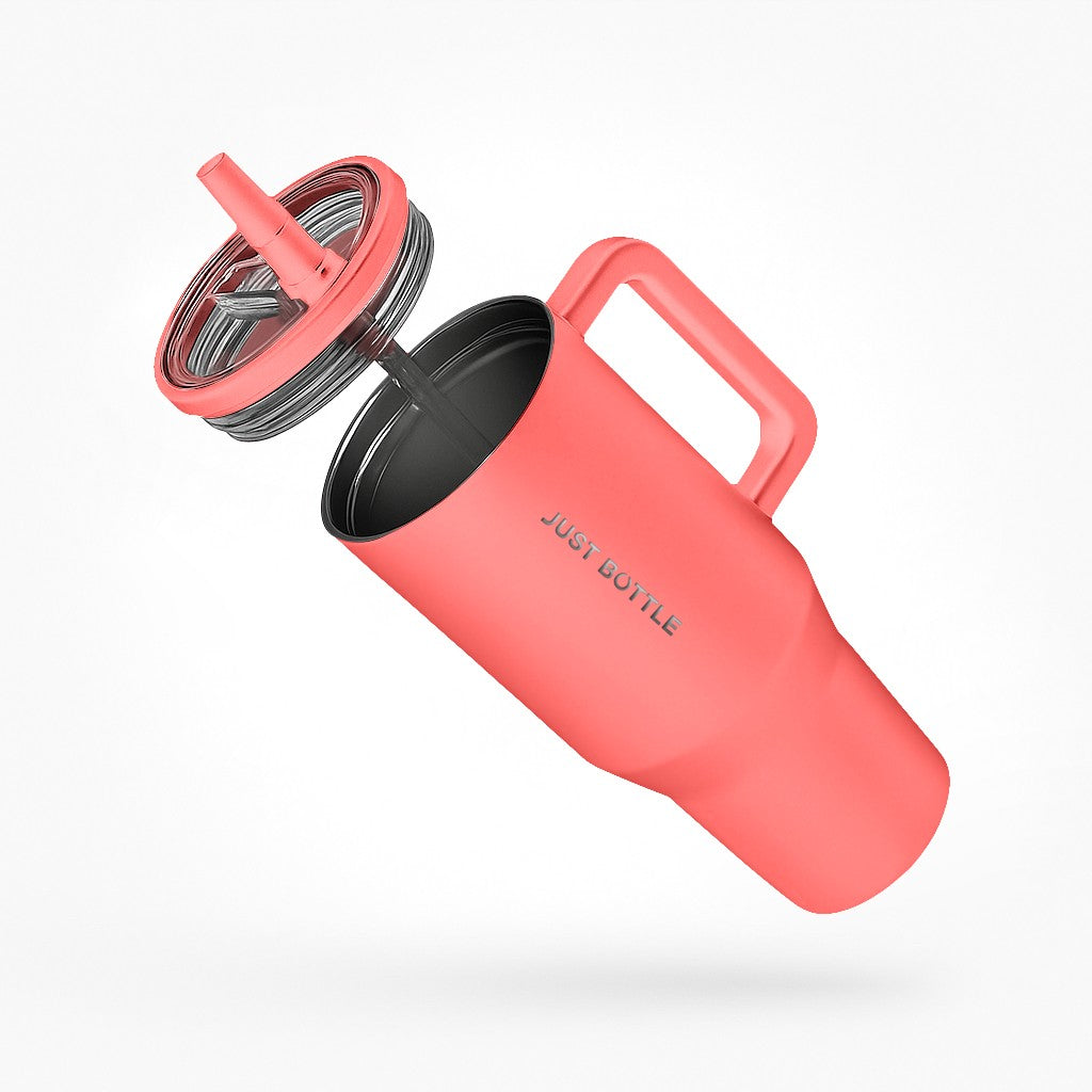 40oz insulated tumbler with straw lid side view in coral orange
