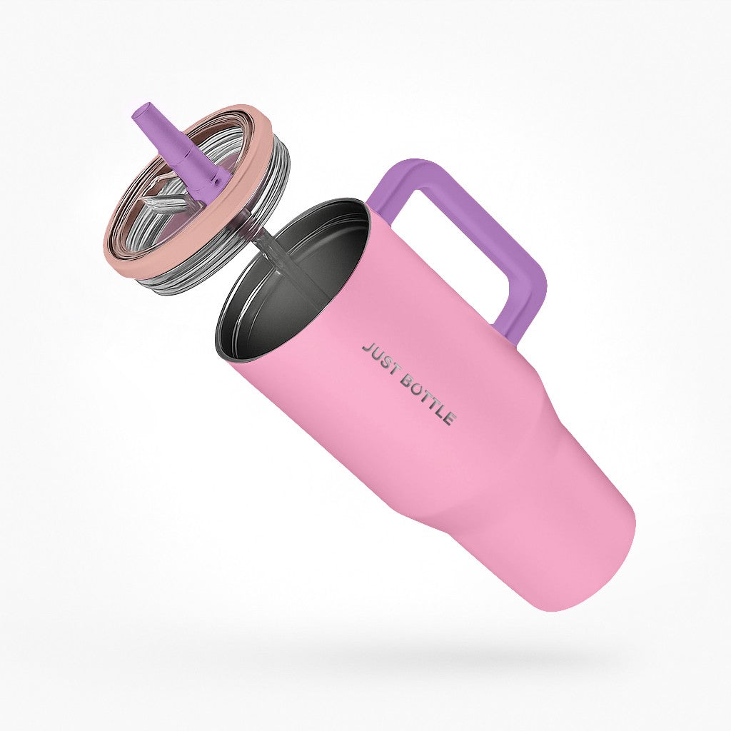 40oz insulated tumbler with straw lid side view in pink with purple handle
