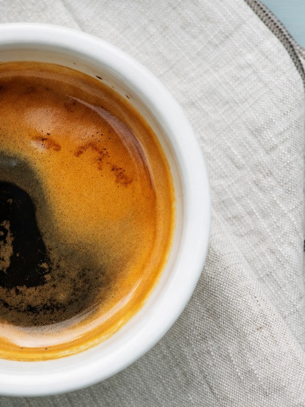 Thick-walled porcelain espresso cup for heat retention and durability