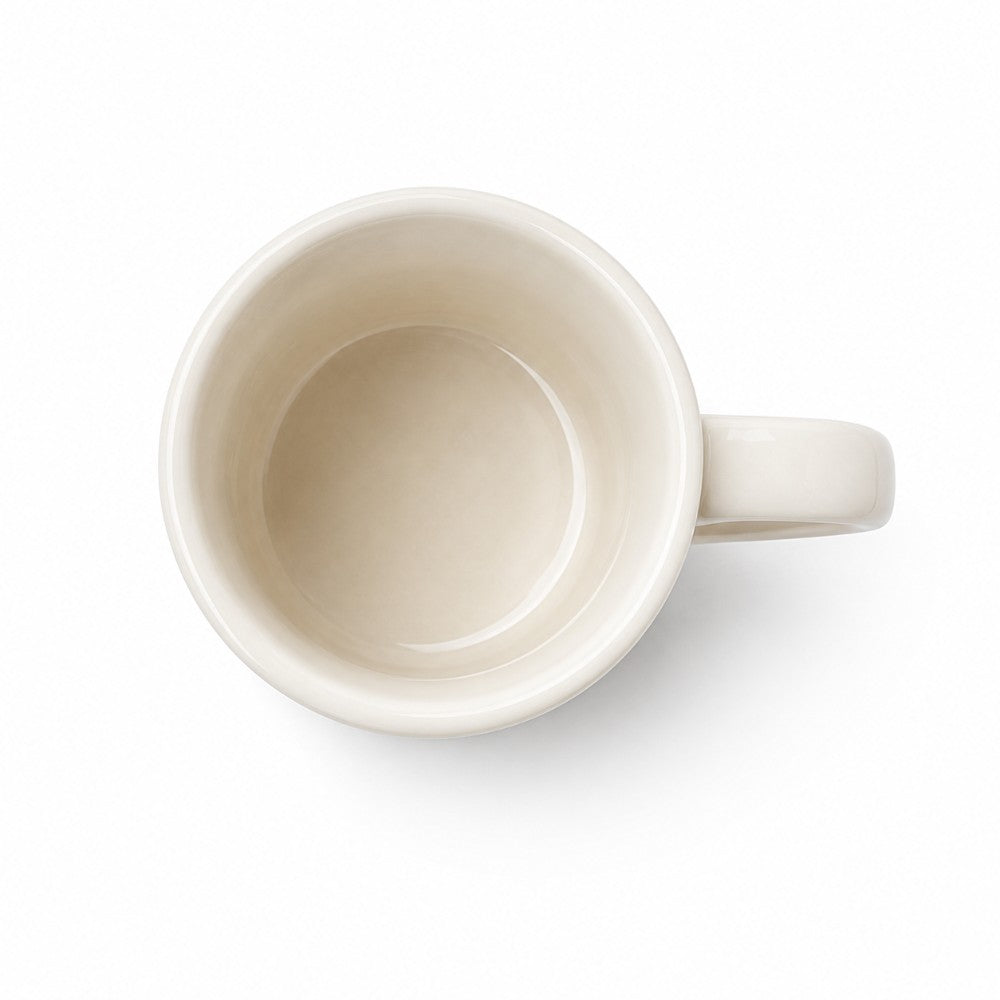 Classic porcelain coffee mug on a white background, top down view