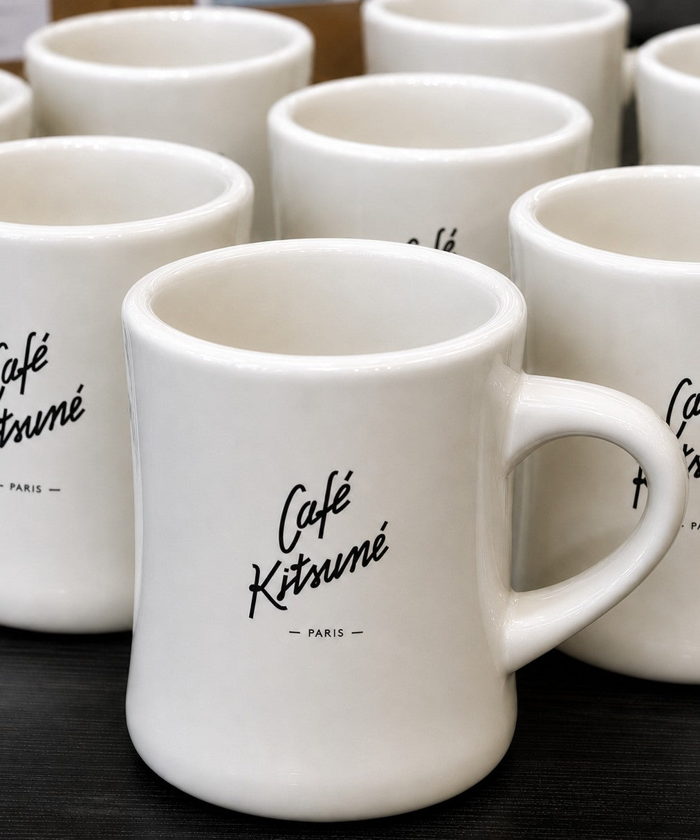 Classic diner mugs with custom branding on a table