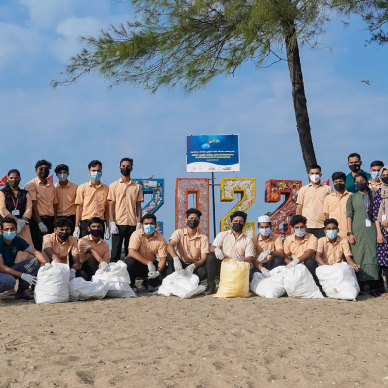 green worms beach clean up