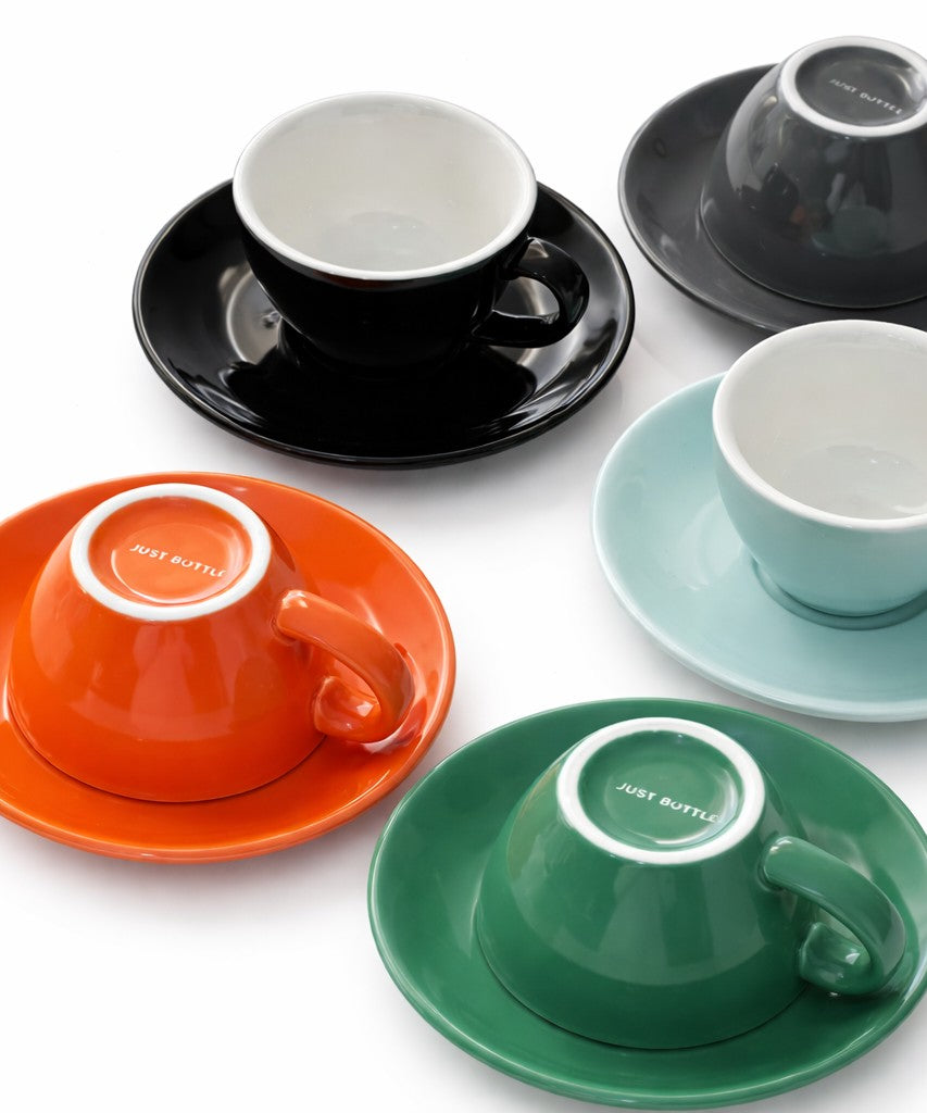 Set of Just Bottle origin cafe cups on a light background