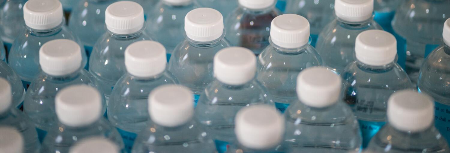 plastic water bottles with white lids