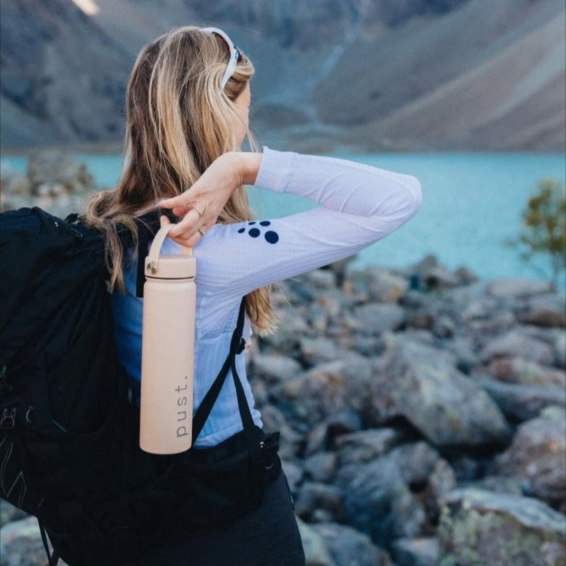 lady holding a branded water bottle