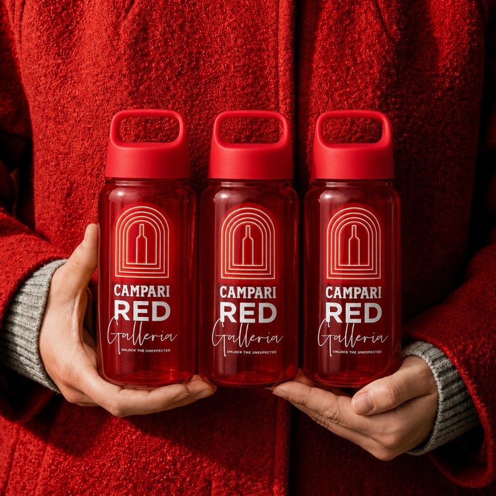 Person in red jacket holding three recycled water bottles with Campari custom branding