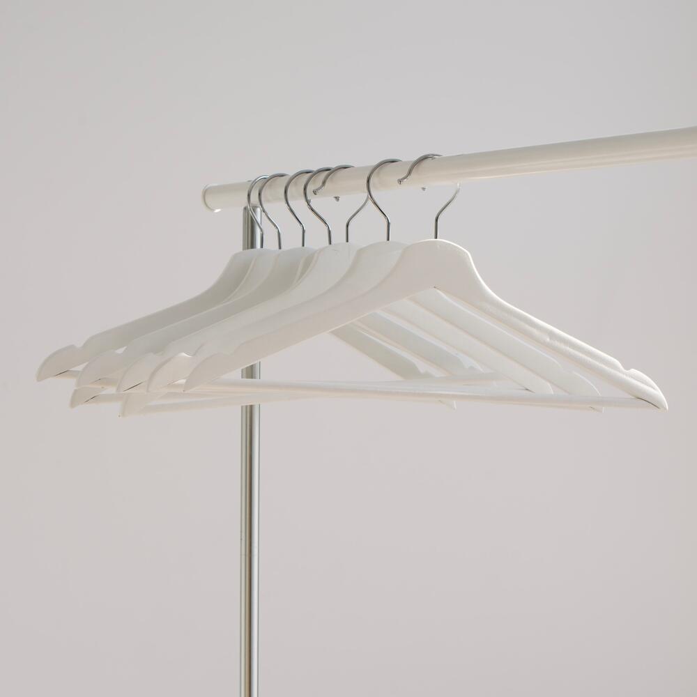 white hangers on a clothes rack