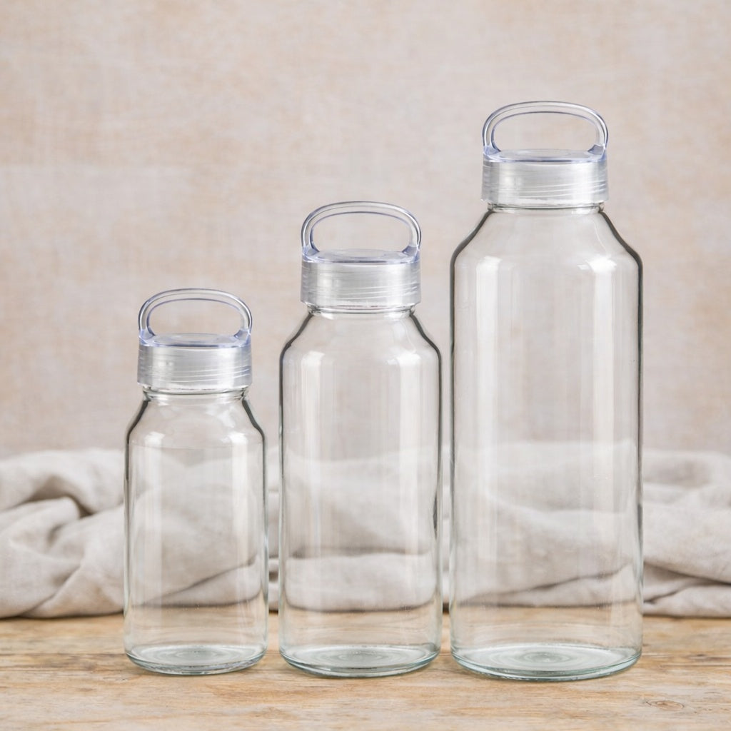 Just Bottle 300ml, 500ml and 900ml Zen Glass borosilicate water bottles next to each other to compare size difference